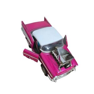 Muscle Machines 1:18 Scale 57 Chevy Magenta With White Top
